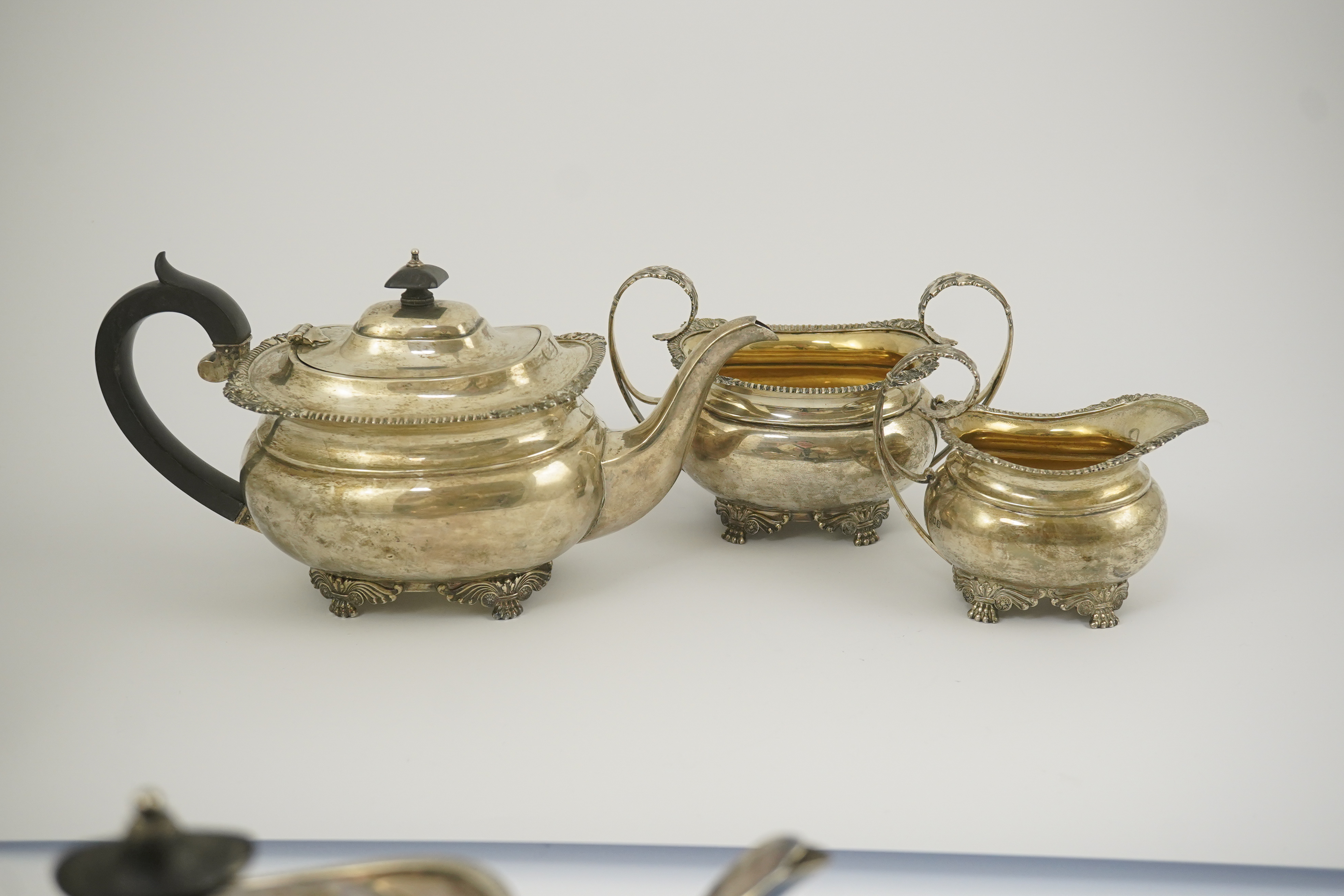 A George V silver three piece tea set by Edward Barnard & Sons Ltd